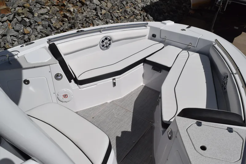 Slide: The Image of 2025 Stingray 216CC boat interior with white seating and speaker, showcasing modern design. - 7