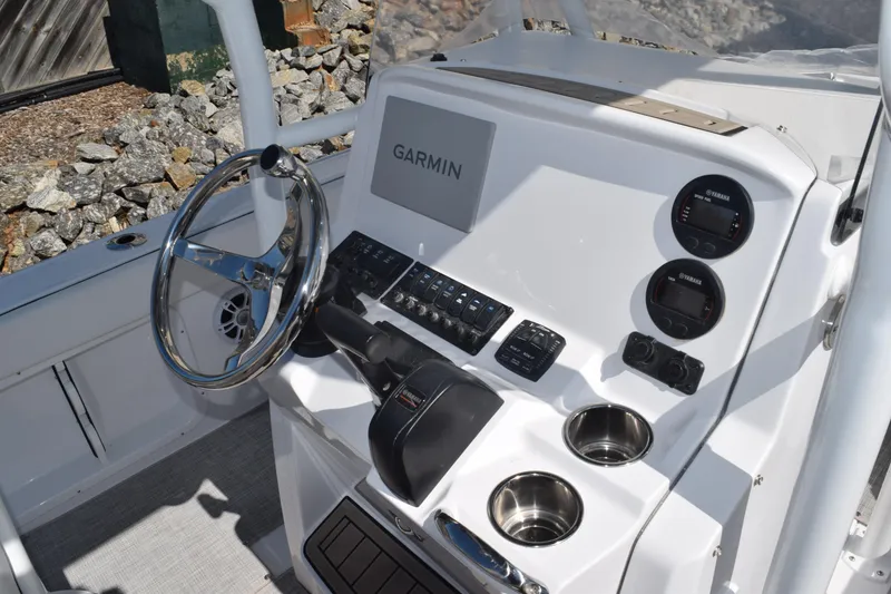 Slide: The Image of 2025 Stingray 216CC boat dashboard with Garmin navigation system and controls. - 8