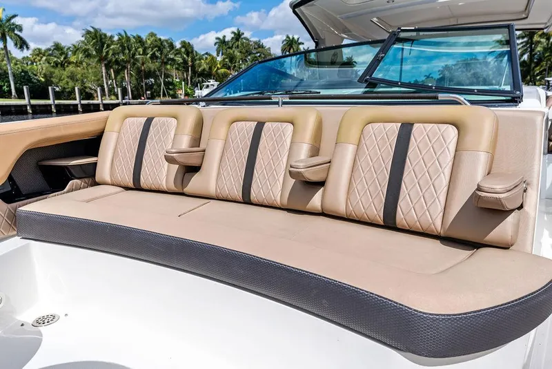 Slide: The Image of 2019 Sea Ray SLX 400 OB boat seating with luxurious tan upholstery. - 19