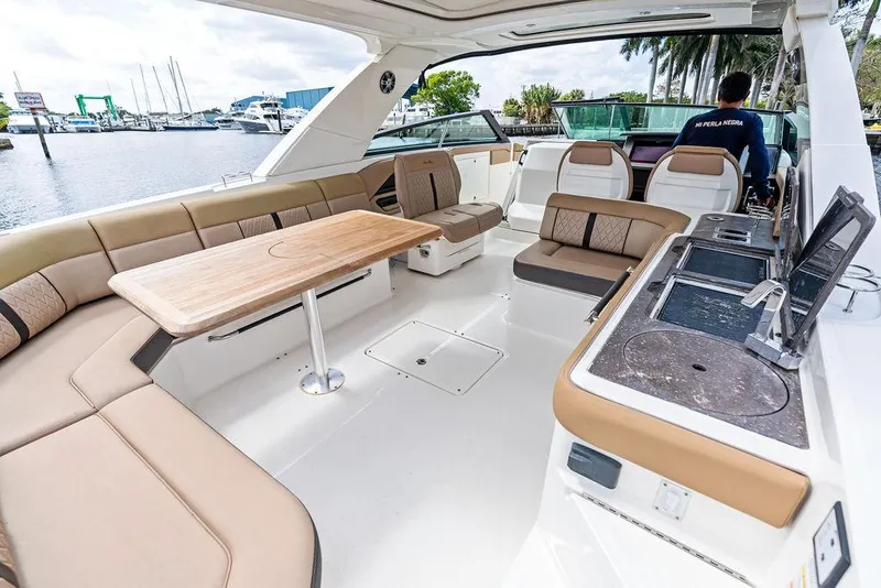 Slide: The Image of 2019 Sea Ray SLX 400 OB boat interior with spacious seating and modern amenities. - 29