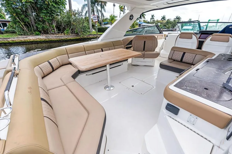 Slide: The Image of 2019 Sea Ray SLX 400 OB boat interior with spacious seating and elegant design. - 35