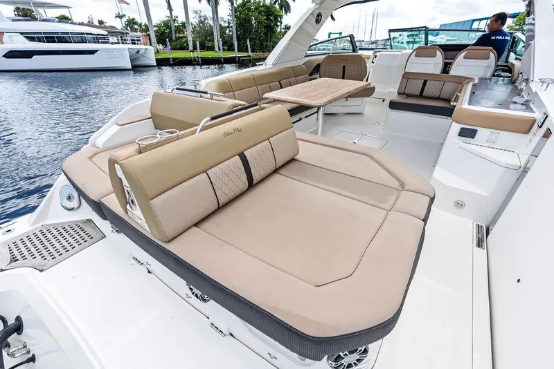 Slide: The Image of 2019 Sea Ray SLX 400 OB boat interior with luxurious seating and spacious deck. - 37