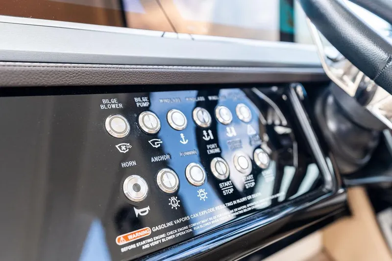 Slide: The Image of Control panel of 2019 Sea Ray SLX 400 OB boat with various function buttons. - 43