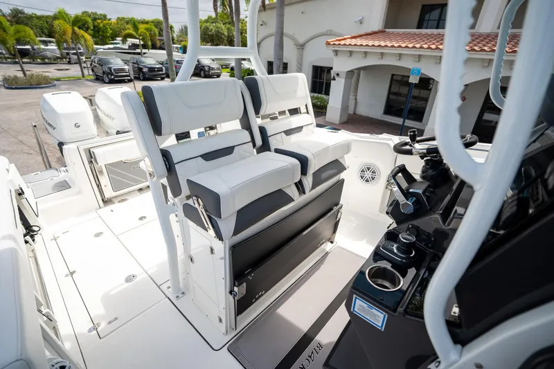 Slide: The Image of 2023 Blackfin 302CC boat interior with modern seating and control panel. - 35