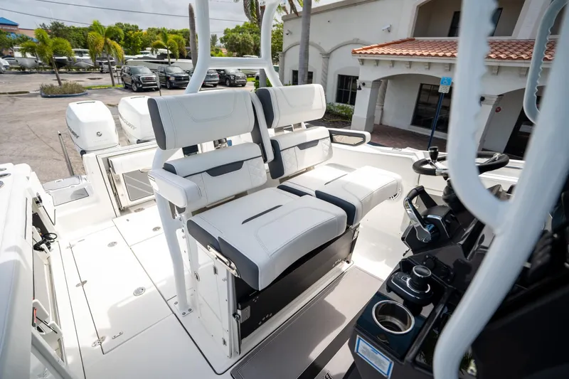Slide: The Image of 2023 Blackfin 302CC boat interior with dual seating and control panel. - 37