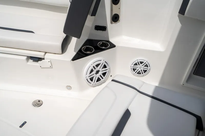 Slide: The Image of Interior of 2023 Blackfin 302CC boat featuring speakers and cup holders. - 43