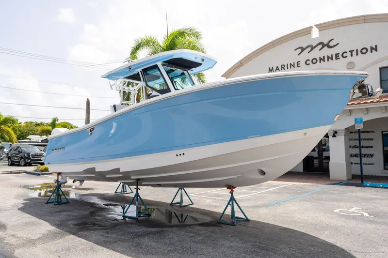 Slide: The Image of 2023 Blackfin 302CC boat displayed at Marine Connection dealership. - 8