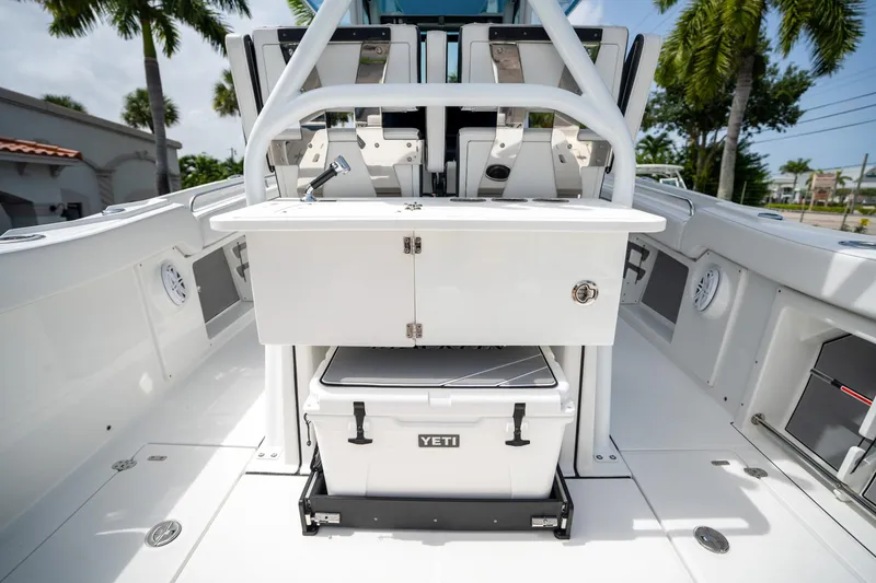 Slide: The Image of 2023 Blackfin 302CC boat interior with Yeti cooler and seating area. - 20
