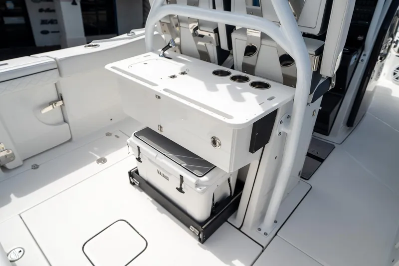 Slide: The Image of 2023 Blackfin 302CC boat interior with storage and seating area. - 21