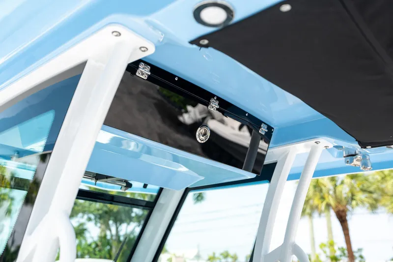 Slide: The Image of 2023 Blackfin 302CC boat interior detail with blue and black accents. - 31
