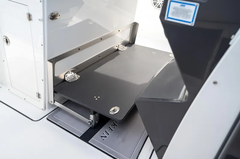 Slide: The Image of 2023 Blackfin 302CC boat interior with foldable storage compartment. - 39