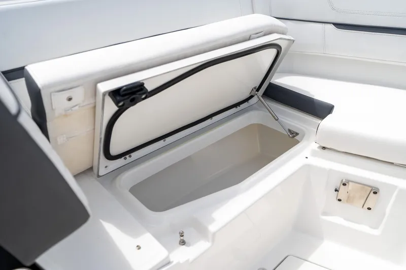 Slide: The Image of Open storage compartment on 2023 Blackfin 302CC boat, showcasing interior space. - 47