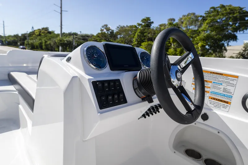 Slide: The Image of 2023 Hurricane SunDeck Sport OB SS 205 OB boat dashboard with steering wheel and controls. - 11