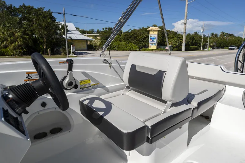 Slide: The Image of 2023 Hurricane SunDeck Sport OB SS 205 OB boat interior with steering wheel and seating. - 14