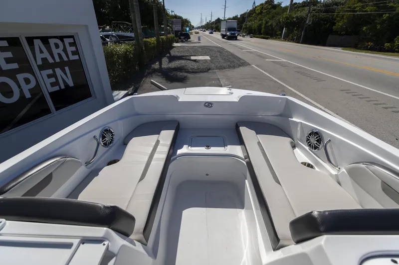Slide: The Image of 2023 Hurricane SunDeck Sport OB SS 205 OB boat interior with seating and speakers. - 17