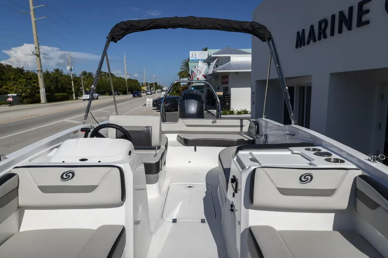 Slide: The Image of 2023 Hurricane SunDeck Sport OB SS 205 OB boat interior at a marina. - 18