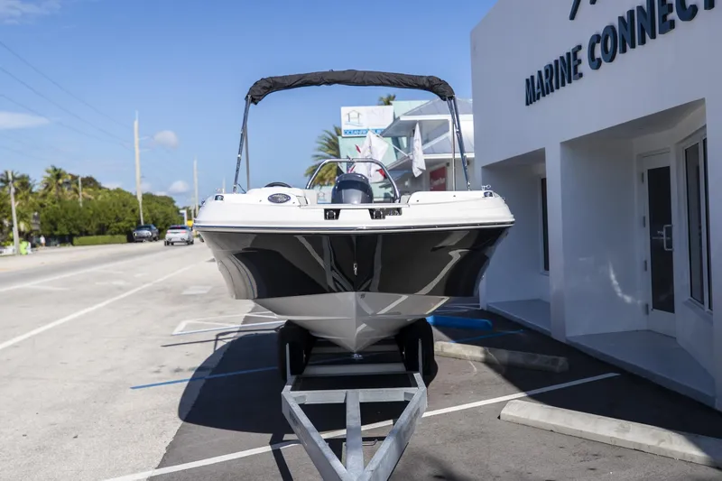 Slide: The Image of 2023 Hurricane SunDeck Sport OB SS 205 OB boat on trailer outside Marine Connection. - 3