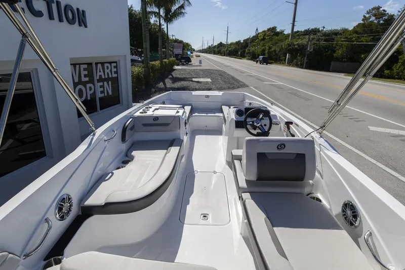 Slide: The Image of 2023 Hurricane SunDeck Sport OB SS 205 OB boat interior with seating and steering wheel. - 6
