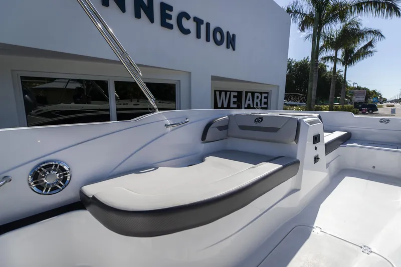 Slide: The Image of 2023 Hurricane SunDeck Sport OB SS 205 OB boat interior with seating and speaker. - 9
