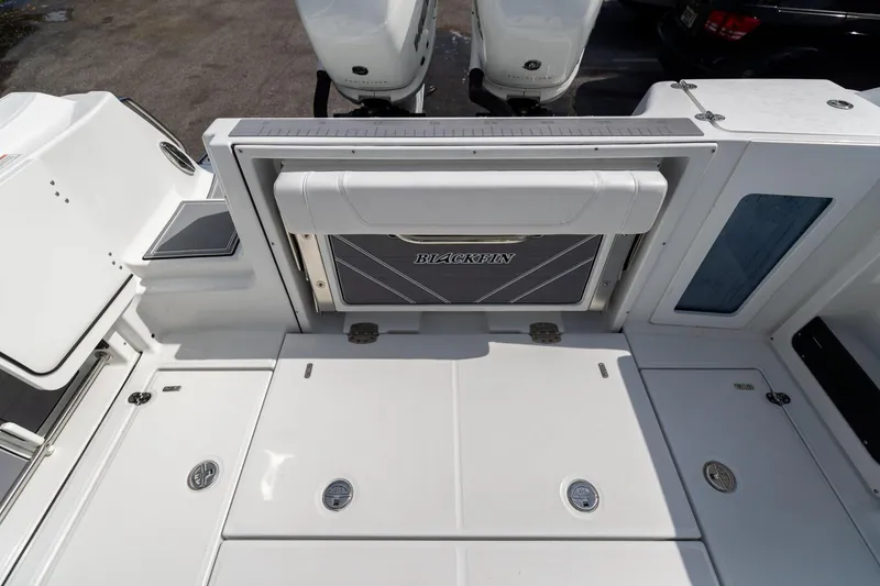 Slide: The Image of 2023 Blackfin 302CC boat deck with storage compartments and seating. - 15