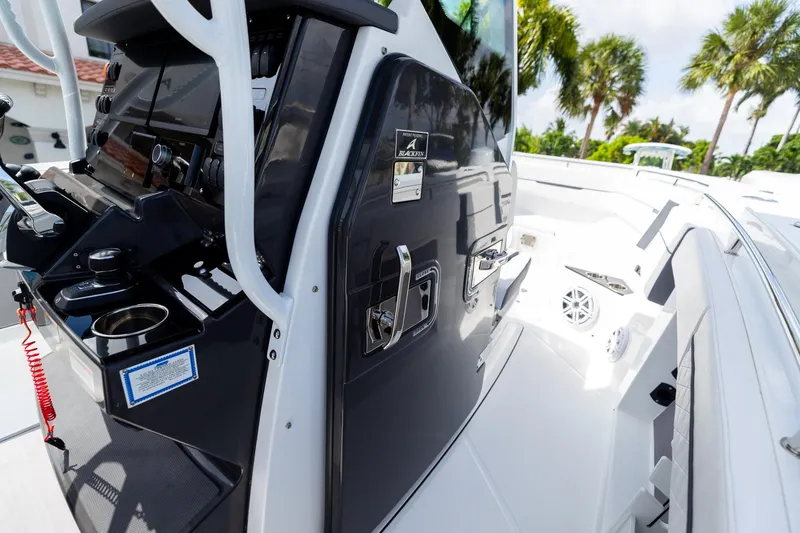 Slide: The Image of 2023 Blackfin 302CC boat interior with control panel and seating area. - 42