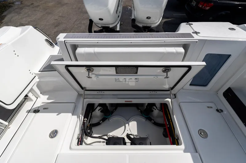 Slide: The Image of 2023 Blackfin 302CC boat with open storage compartment, showcasing interior details. - 16