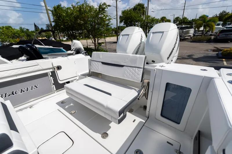 Slide: The Image of 2023 Blackfin 302CC boat with seating and dual Mercury engines. - 18