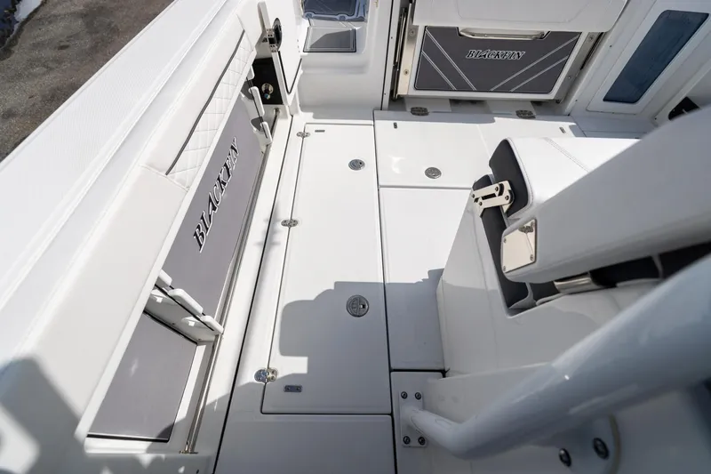 Slide: The Image of 2023 Blackfin 302CC boat interior with seating and storage compartments. - 20