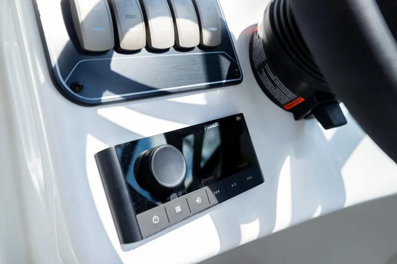 Slide: The Image of Control panel of 2023 Hurricane SunDeck 2200 OB boat with stereo and Bluetooth features. - 19