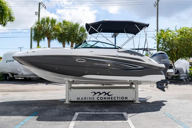 Slide: The Image of 2023 Hurricane SunDeck 2200 OB boat displayed at Marine Connection dealership. - 5
