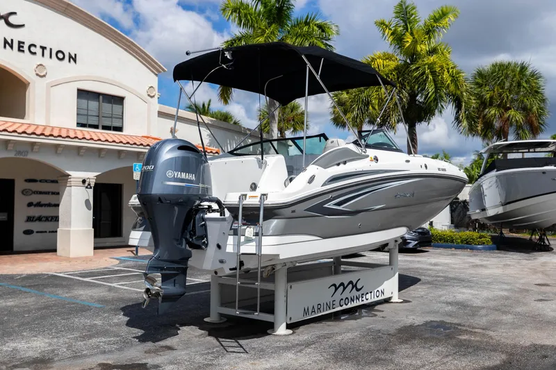 Slide: The Image of 2023 Hurricane SunDeck 2200 OB boat displayed at Marine Connection dealership. - 8