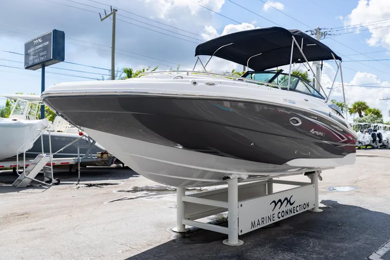 Slide: The Image of 2023 Hurricane SunDeck 2200 OB boat displayed at Marine Connection dealership. - 4
