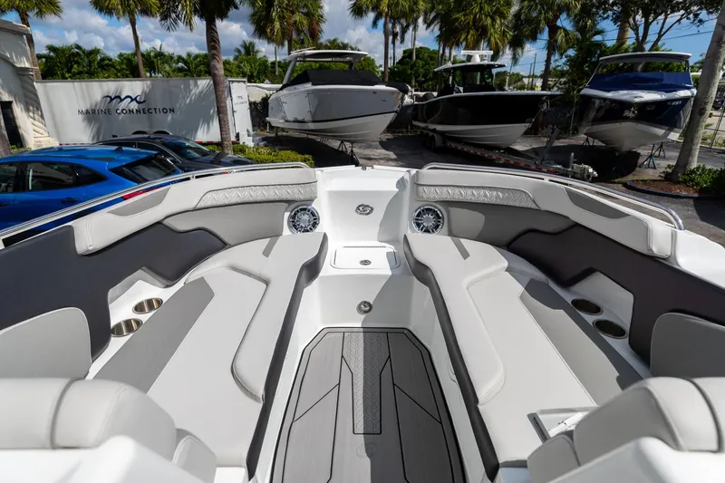 Slide: The Image of 2023 Hurricane SunDeck 2200 OB boat interior with plush seating and modern design. - 31