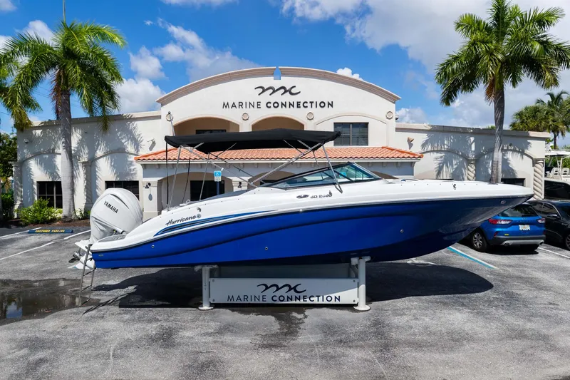 Slide: The Image of 2023 Hurricane SunDeck 2690 OB boat displayed at Marine Connection dealership. - 1