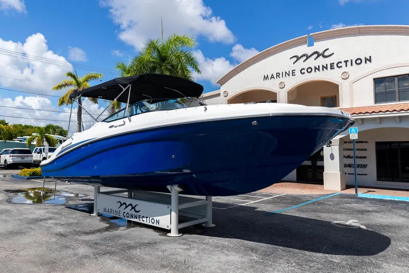 Slide: The Image of 2023 Hurricane SunDeck 2690 OB boat displayed at Marine Connection dealership. - 2