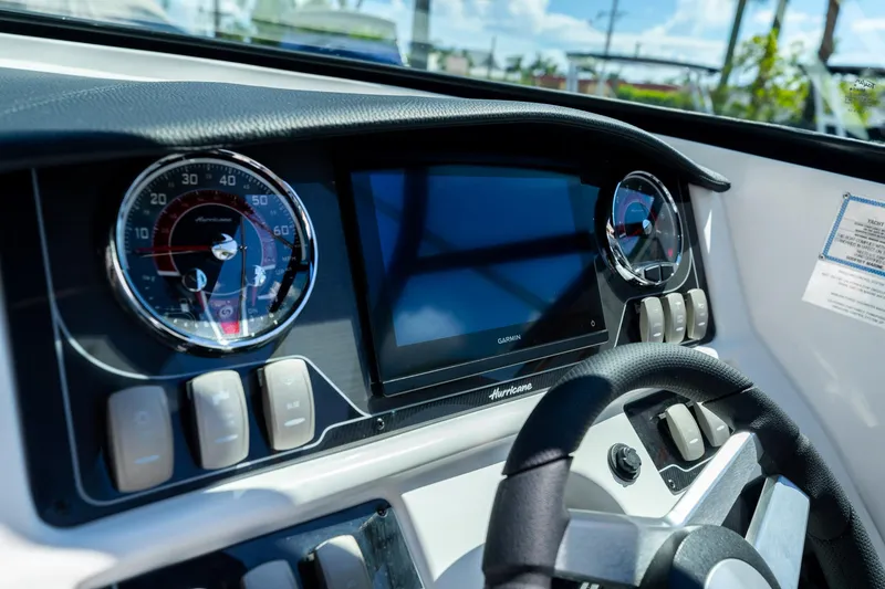 Slide: The Image of Dashboard of 2023 Hurricane SunDeck 2690 OB boat with gauges and Garmin display. - 20