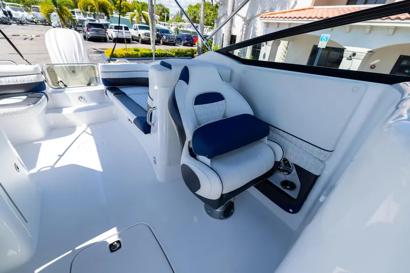 Slide: The Image of 2023 Hurricane SunDeck 2690 OB boat interior with plush seating and modern design. - 23