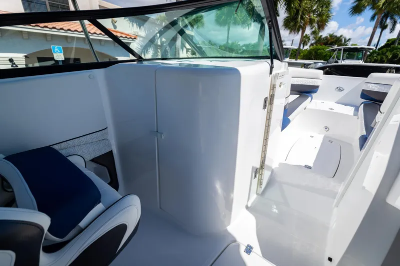Slide: The Image of 2023 Hurricane SunDeck 2690 OB interior, featuring sleek seating and modern design elements. - 25