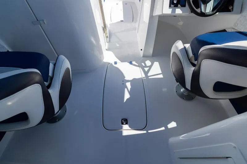 Slide: The Image of 2023 Hurricane SunDeck 2690 OB interior with modern seating and sleek design. - 27