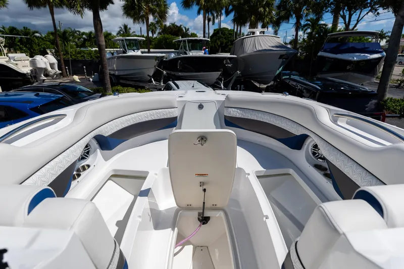 Slide: The Image of 2023 Hurricane SunDeck 2690 OB boat interior with luxurious seating and modern design. - 32