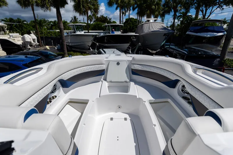 Slide: The Image of 2023 Hurricane SunDeck 2690 OB boat interior with spacious seating and storage compartments. - 33