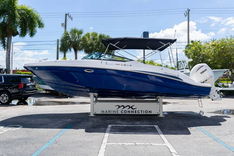 Slide: The Image of 2023 Hurricane SunDeck 2690 OB boat displayed at Marine Connection dealership. - 5