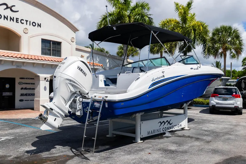 Slide: The Image of 2023 Hurricane SunDeck 2690 OB boat displayed at Marine Connection dealership. - 8