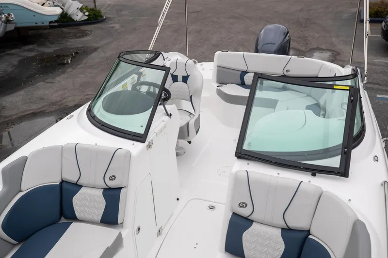 Slide: The Image of 2023 Hurricane SunDeck 2200 OB boat interior with seating and windshield. - 31