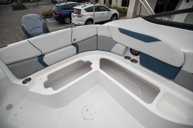 Slide: The Image of 2023 Hurricane SunDeck 2200 OB boat interior with spacious seating and storage compartments. - 33