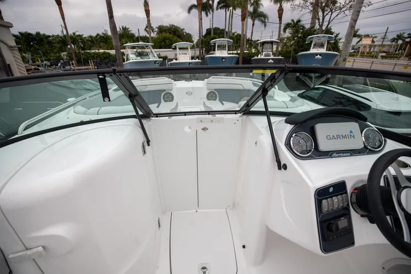 Slide: The Image of 2023 Hurricane SunDeck 2200 OB boat interior with Garmin dashboard and steering wheel. - 35