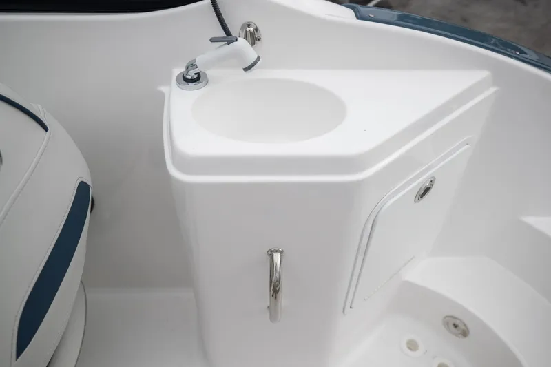 Slide: The Image of 2023 Hurricane SunDeck 2200 OB boat sink and storage compartment. - 48