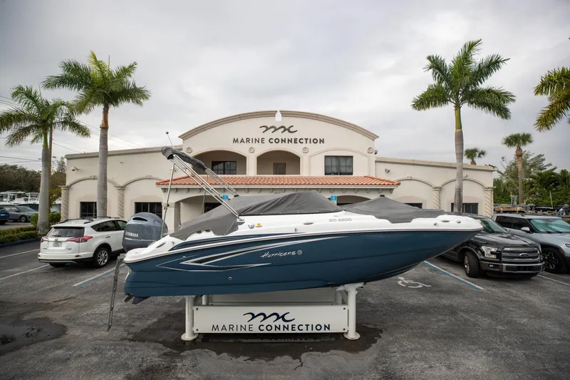 Slide: The Image of 2023 Hurricane SunDeck 2200 OB boat displayed at Marine Connection dealership. - 7