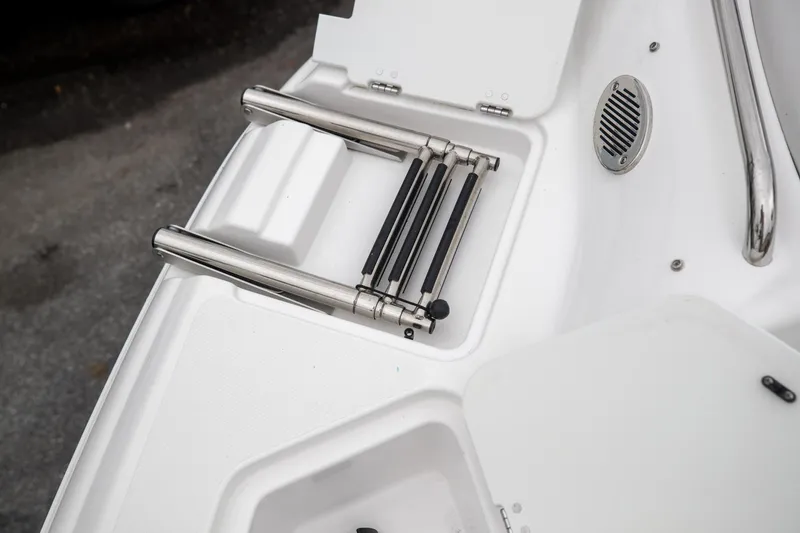 Slide: The Image of 2023 Hurricane SunDeck 2200 OB boat ladder and deck detail. - 29