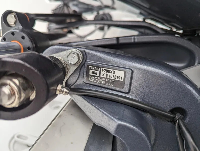 Slide: The Image of Close-up of Yamaha F200XB motor on 2023 Hurricane SunDeck 2200 OB boat. - 37